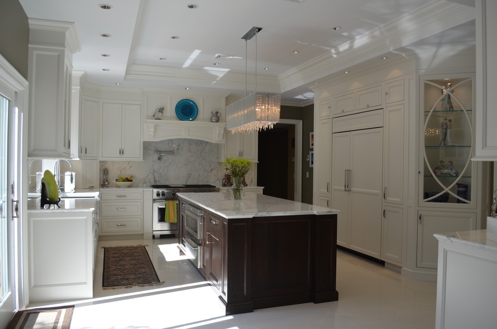 Mid-sized modern u-shaped eat-in kitchen in New York with a farmhouse sink, recessed-panel cabinets, white cabinets, marble benchtops, panelled appliances, porcelain floors and with island.