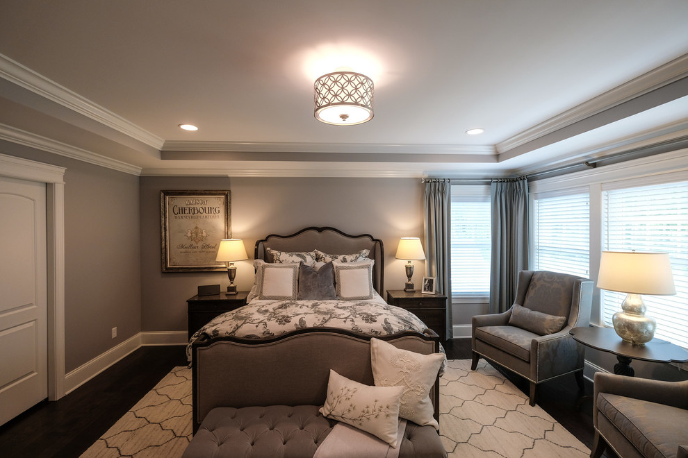 Inspiration for a transitional master bedroom in Detroit with grey walls, dark hardwood floors and brown floor.