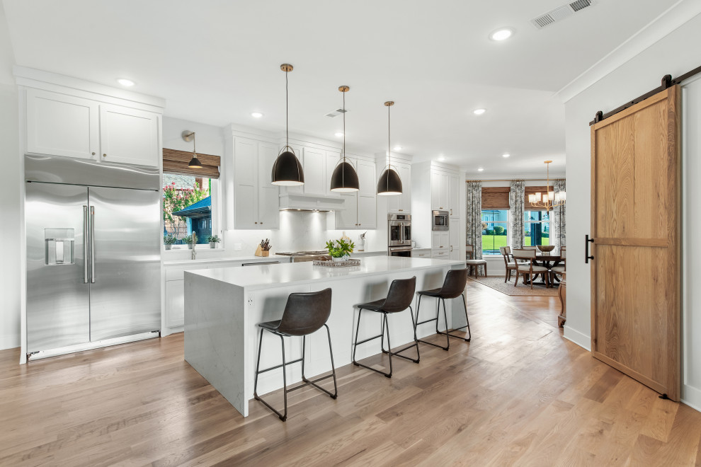 Large transitional single-wall open concept kitchen photo with an island