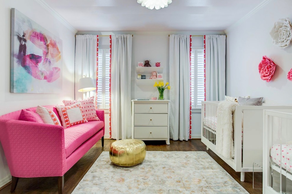 Photo of a transitional nursery for girls in Dallas with grey walls and dark hardwood floors.