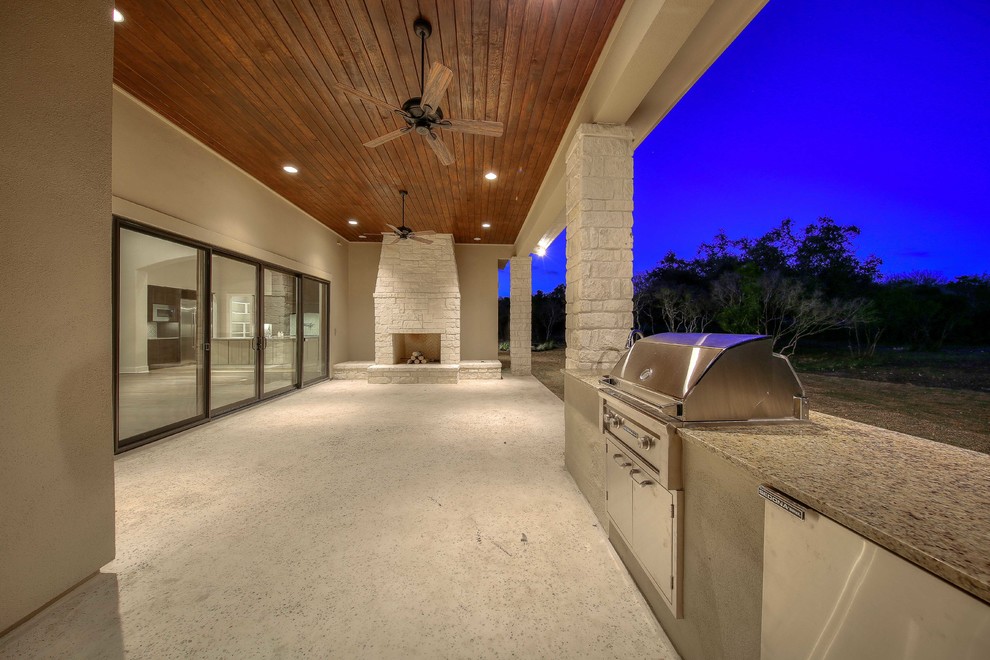 This is an example of a large transitional two-storey stucco beige exterior in Austin.