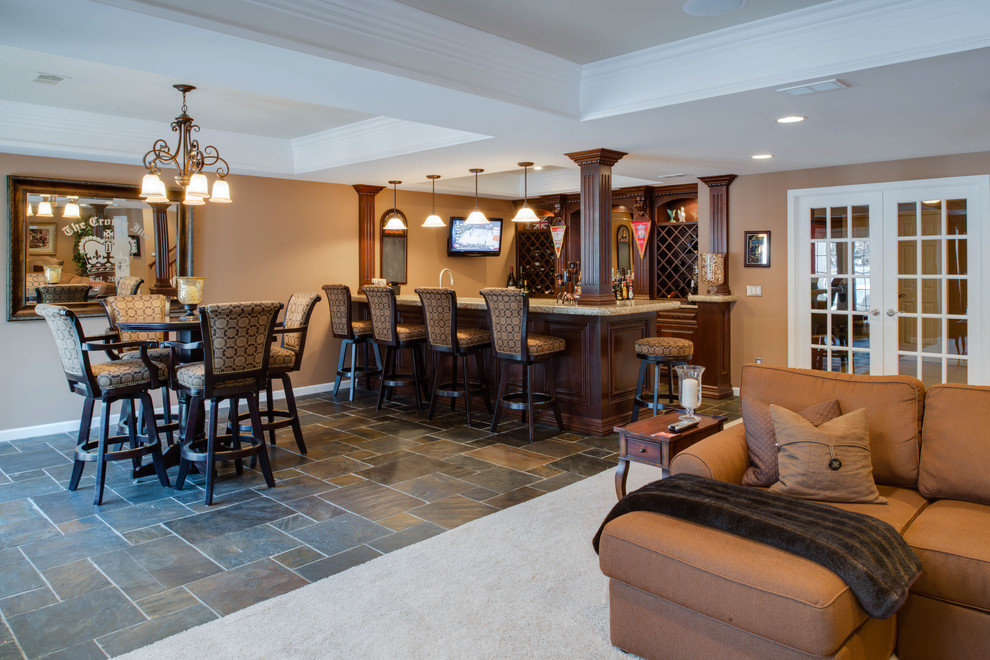 Design ideas for a large traditional basement in Detroit with brown walls, slate floors, no fireplace and a home bar.