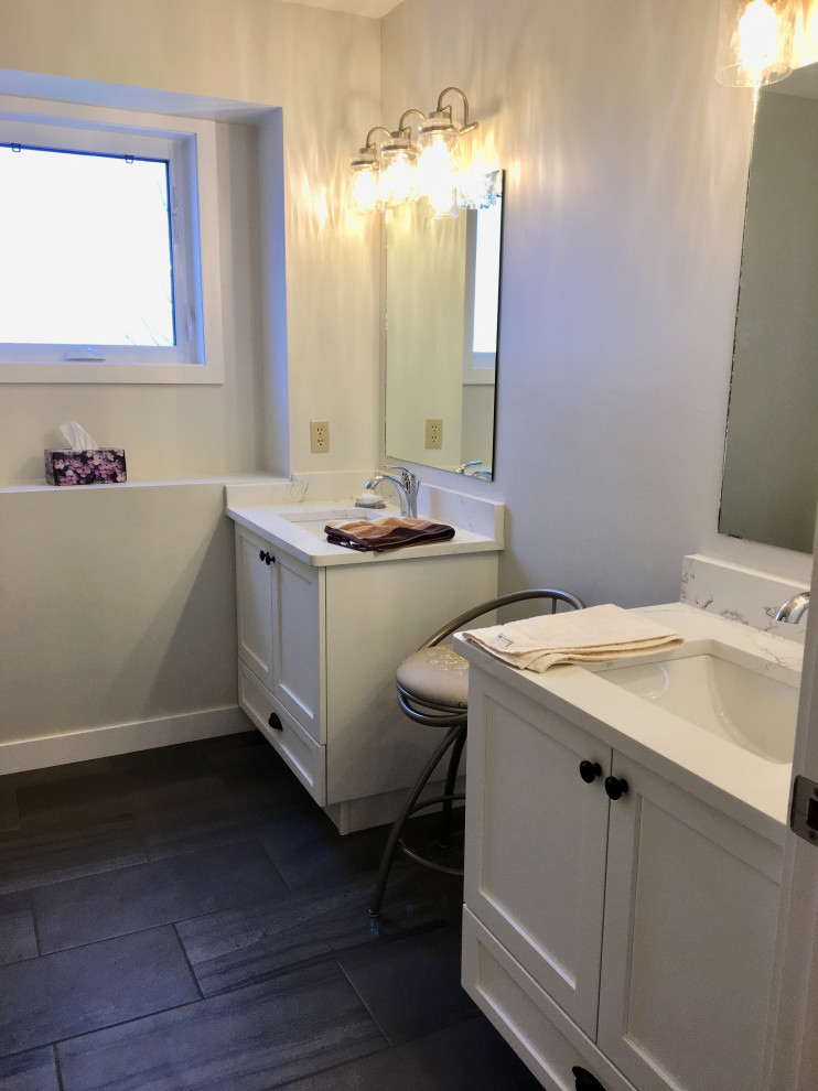 Example of a mid-sized transitional kids' white tile and ceramic tile gray floor, double-sink and ceramic tile tub/shower combo design with shaker cabinets, white cabinets, a two-piece toilet, an undermount sink, quartzite countertops, white countertops, a built-in vanity and white walls