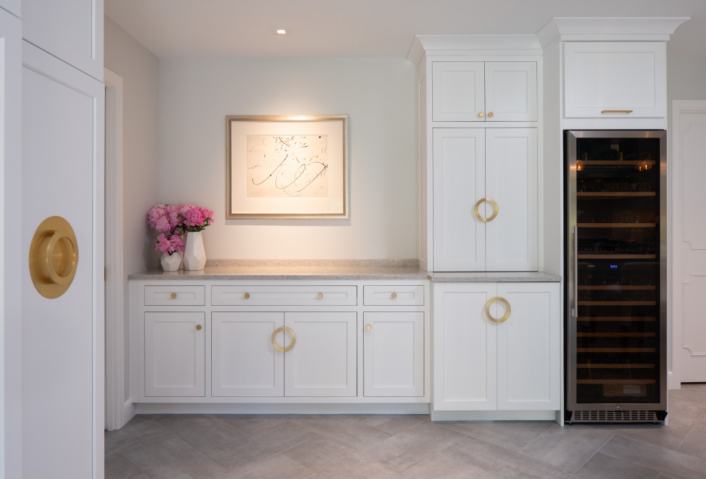 Photo of a small contemporary home bar in Philadelphia with shaker cabinets, white cabinets, engineered stone countertops, porcelain flooring, grey floors and grey worktops.
