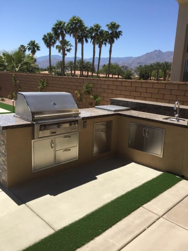 Inspiration for a mid-sized backyard concrete paver hot tub remodel