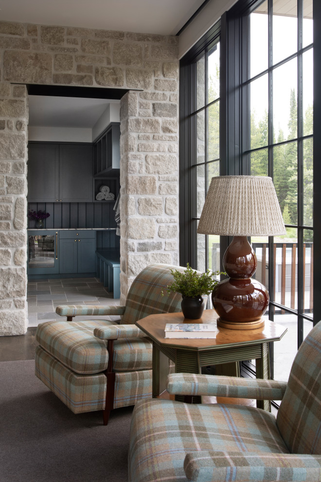 Example of a large mountain style open concept medium tone wood floor and brown floor family room design in Los Angeles with white walls, a corner fireplace, a plaster fireplace and a wall-mounted tv
