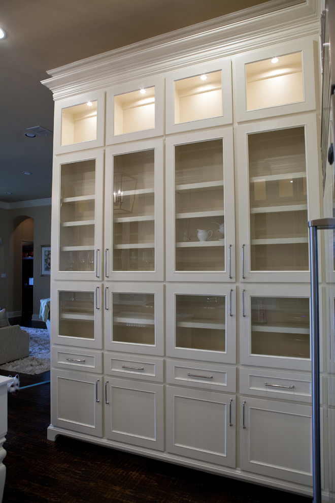 Example of a large transitional u-shaped dark wood floor and gray floor open concept kitchen design in Dallas with an undermount sink, glass-front cabinets, white cabinets, quartz countertops, white backsplash, stone tile backsplash, stainless steel appliances and an island