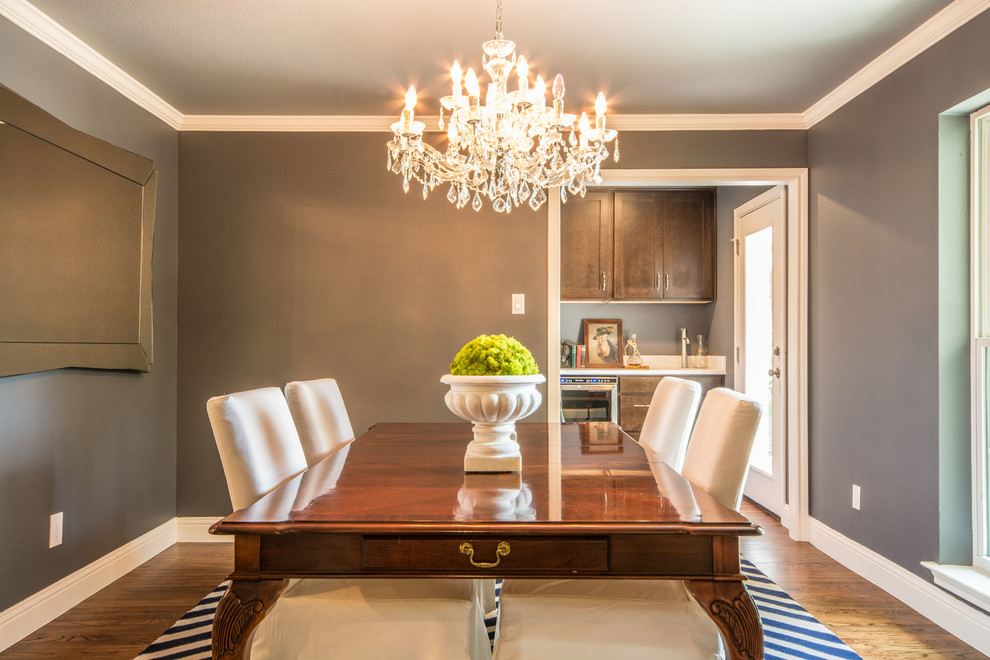 Photo of a transitional dining room in Dallas with grey walls and medium hardwood floors.