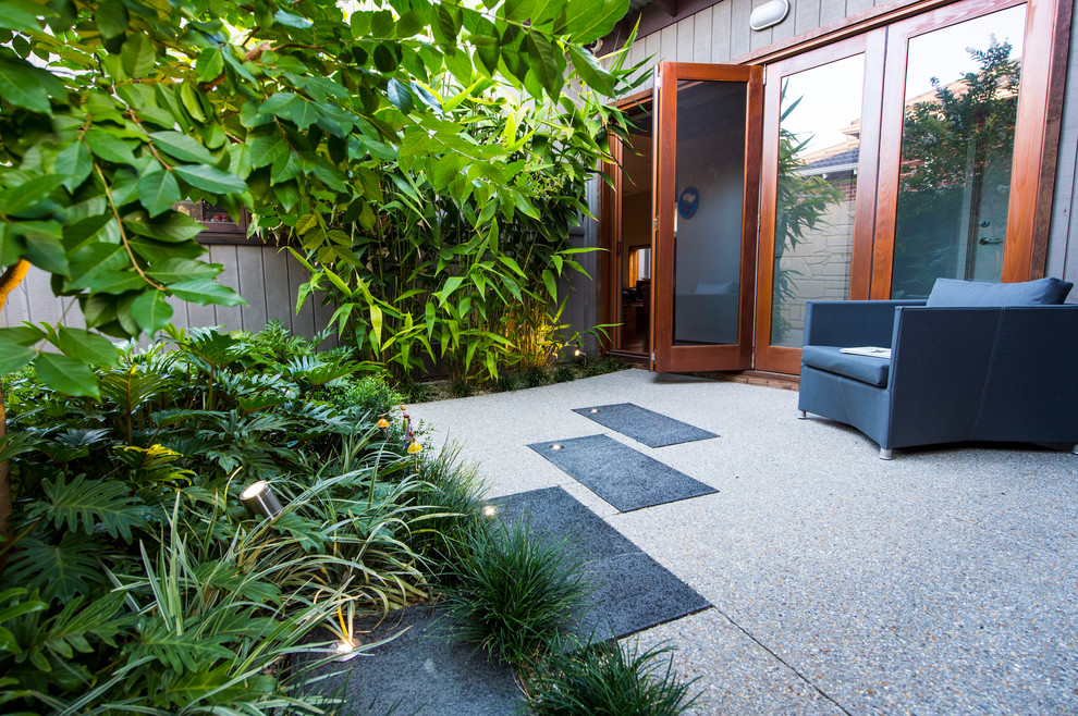 Inspiration for a small contemporary courtyard patio in Perth with concrete slab.