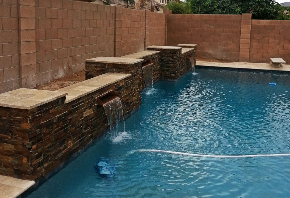 Pool fountain - large transitional backyard stone and rectangular lap pool fountain idea in Phoenix