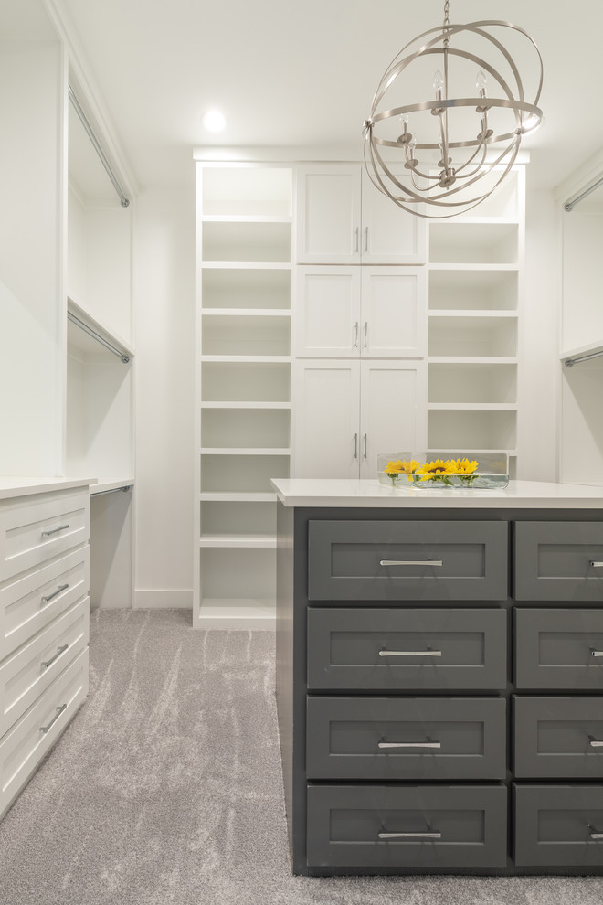 Photo of a mid-sized contemporary gender-neutral walk-in wardrobe in Dallas with shaker cabinets, white cabinets, carpet and grey floor.