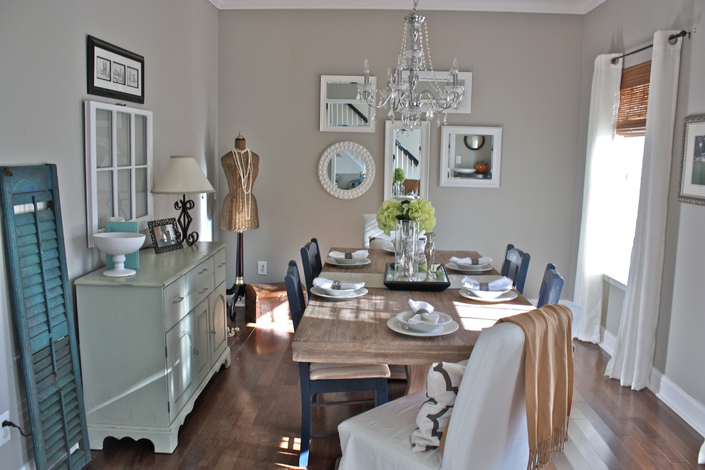 Inspiration for a traditional dining room in Charlotte with grey walls.