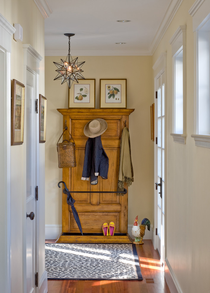 Traditional entry hall in Boston with beige walls.