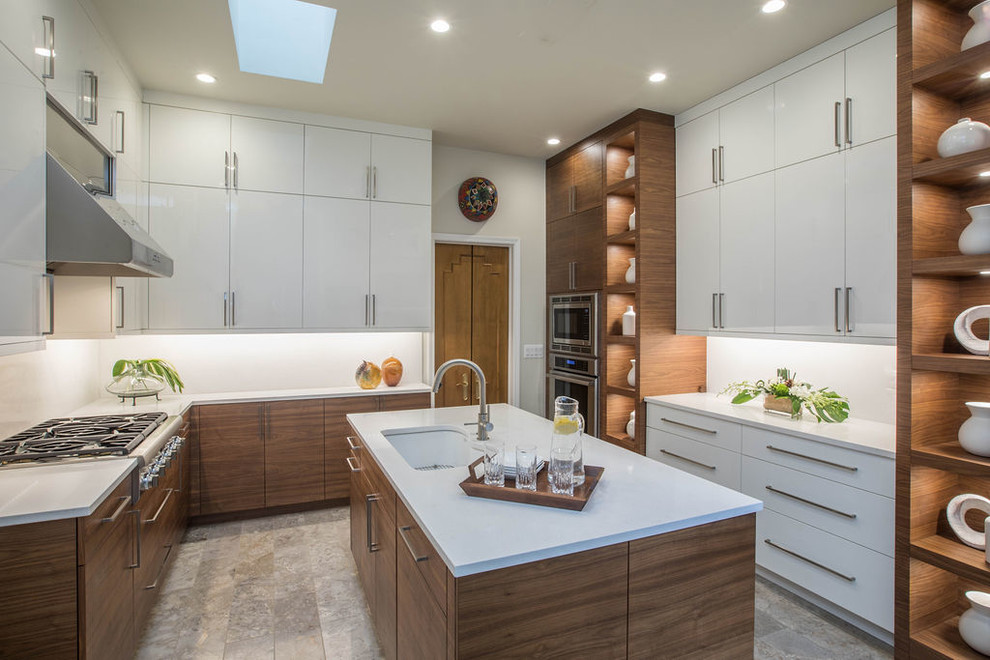 Inspiration for a mid-sized contemporary l-shaped separate kitchen in Detroit with an undermount sink, flat-panel cabinets, white cabinets, quartz benchtops, white splashback, stainless steel appliances, limestone floors, with island, white benchtop, stone slab splashback and grey floor.