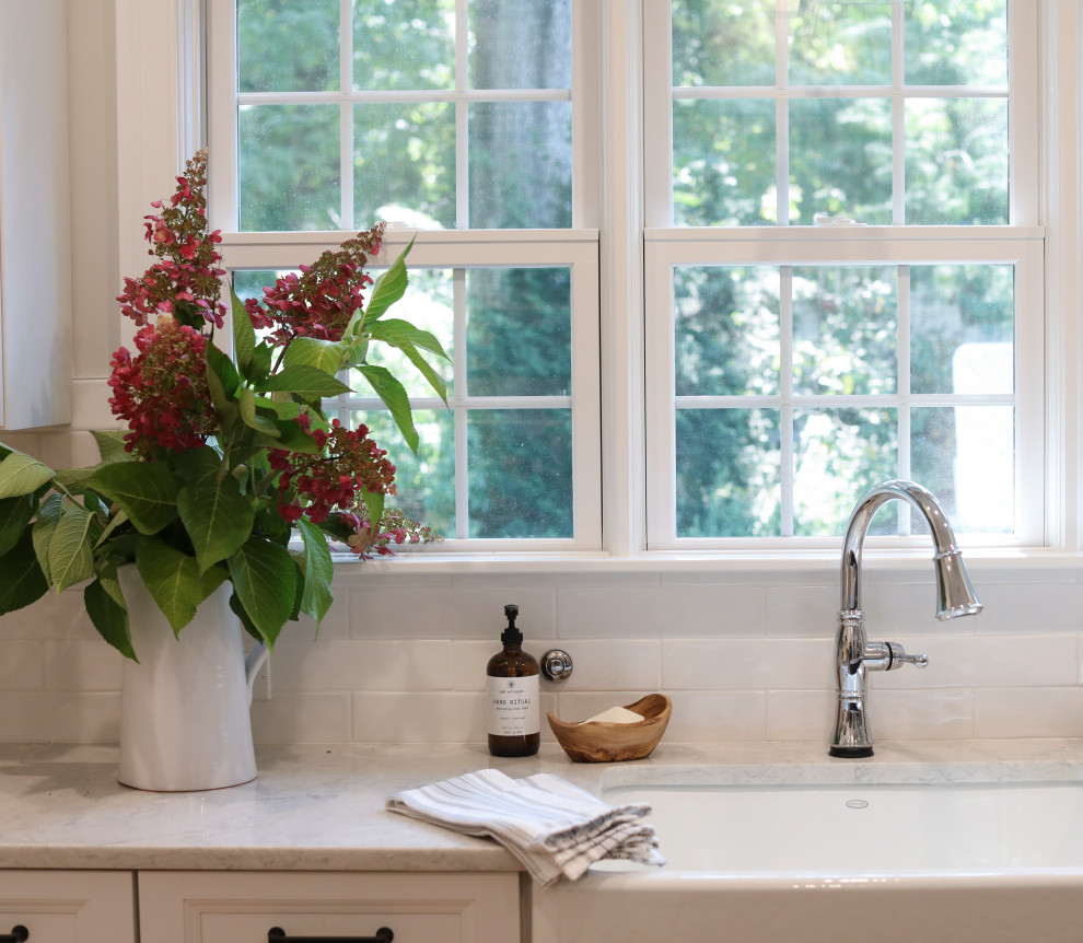 Inspiration for a transitional kitchen remodel in Boston with white backsplash