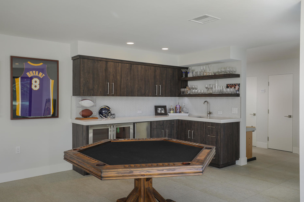 Contemporary l-shaped wet bar in San Diego with an undermount sink, flat-panel cabinets and tile benchtops.