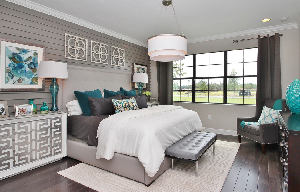 Photo of a transitional guest bedroom in Orlando with grey walls and dark hardwood floors.