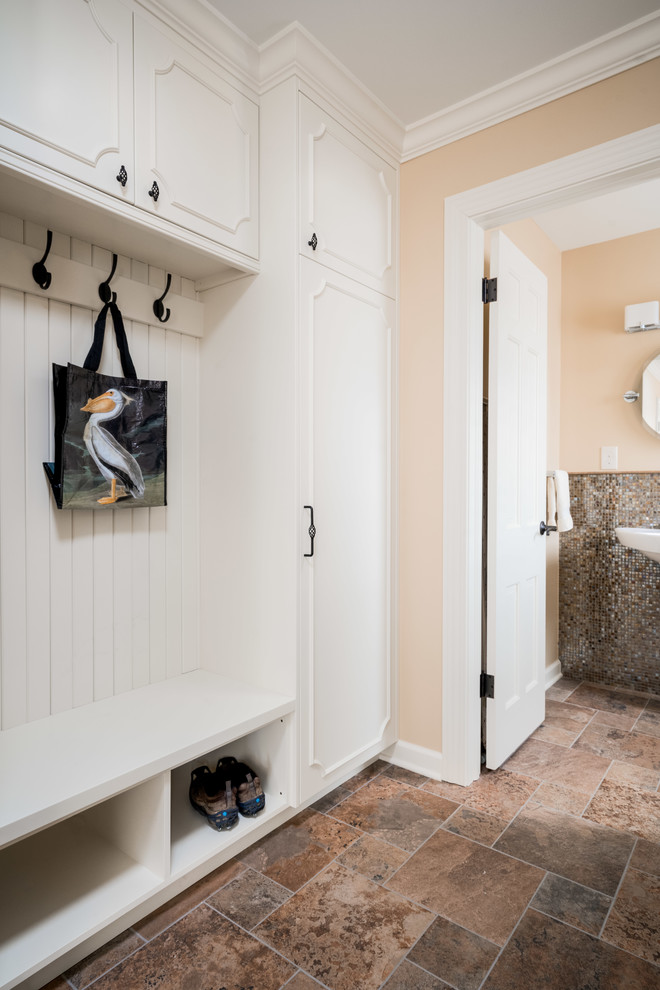 This is an example of a mid-sized transitional hallway in Columbus with beige walls, porcelain floors and multi-coloured floor.