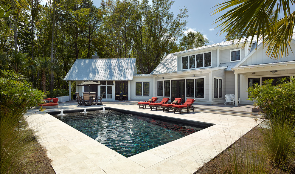 Mid-sized country rectangular natural pool in Charleston with a hot tub and concrete pavers.