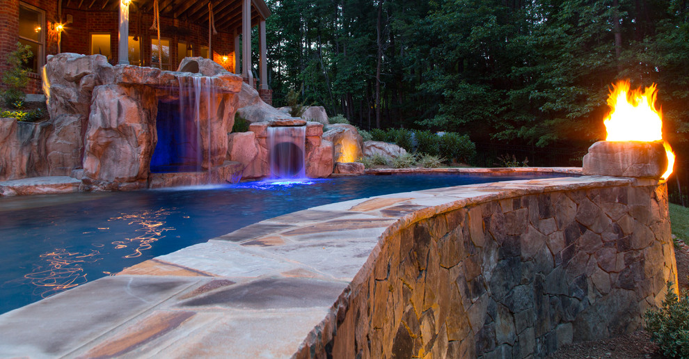 Example of a mountain style home design design in Charlotte