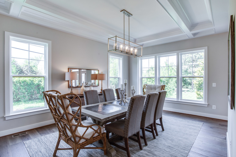 Inspiration for a transitional separate dining room in DC Metro with grey walls, medium hardwood floors, brown floor and coffered.