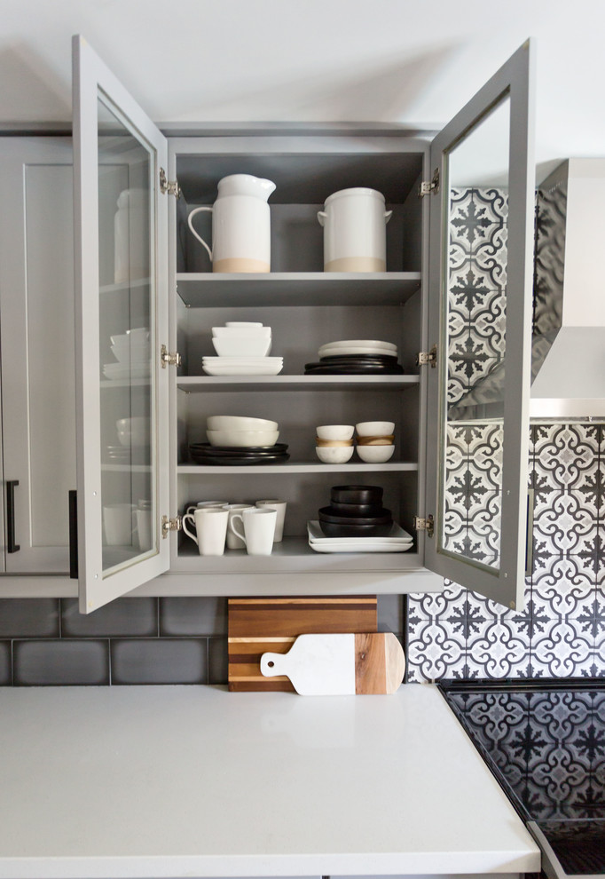 Mid-sized transitional u-shaped light wood floor and gray floor eat-in kitchen photo in Phoenix with an undermount sink, recessed-panel cabinets, gray cabinets, quartz countertops, multicolored backsplash, ceramic backsplash, stainless steel appliances, an island and white countertops