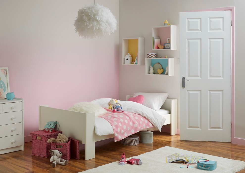Inspiration for a mid-sized contemporary kids' room in Hampshire with medium hardwood floors and multi-coloured walls.