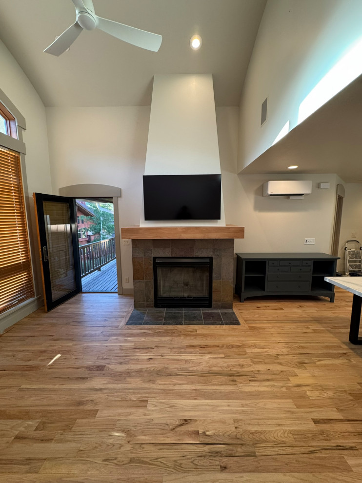 Great room new wood mantel. fireplace, new ceiling fans,