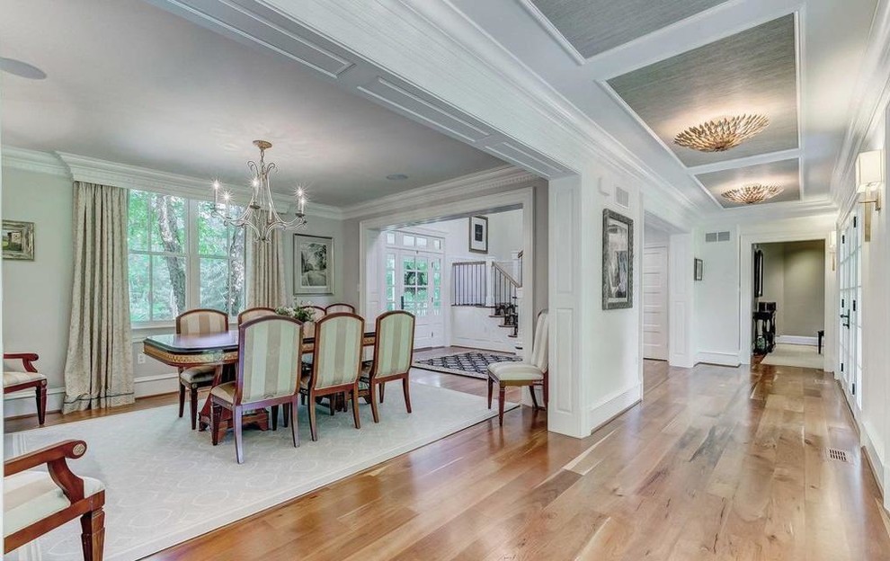 Enclosed dining room - large transitional light wood floor and beige floor enclosed dining room idea in Baltimore with white walls and no fireplace