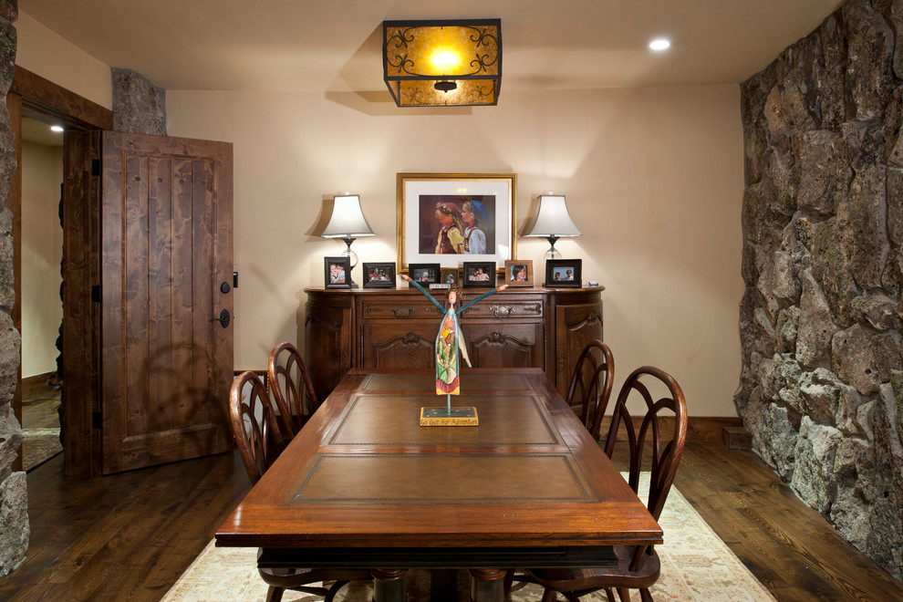 Country separate dining room in Denver with beige walls and dark hardwood floors.