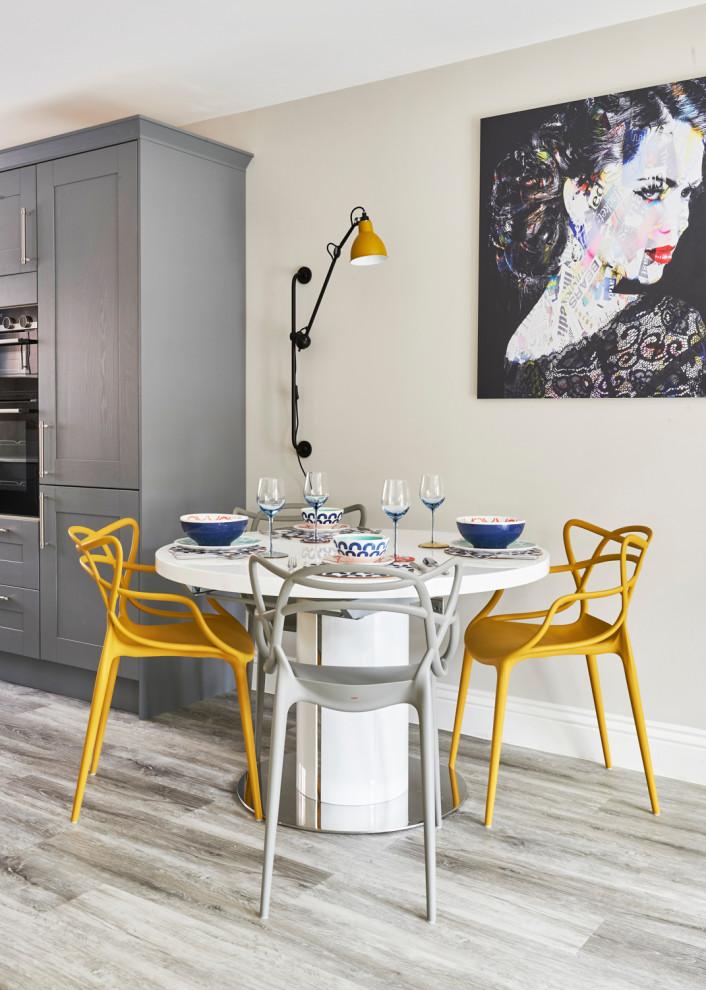 Inspiration for a mid-sized contemporary open plan dining in Essex with grey walls, vinyl floors and grey floor.