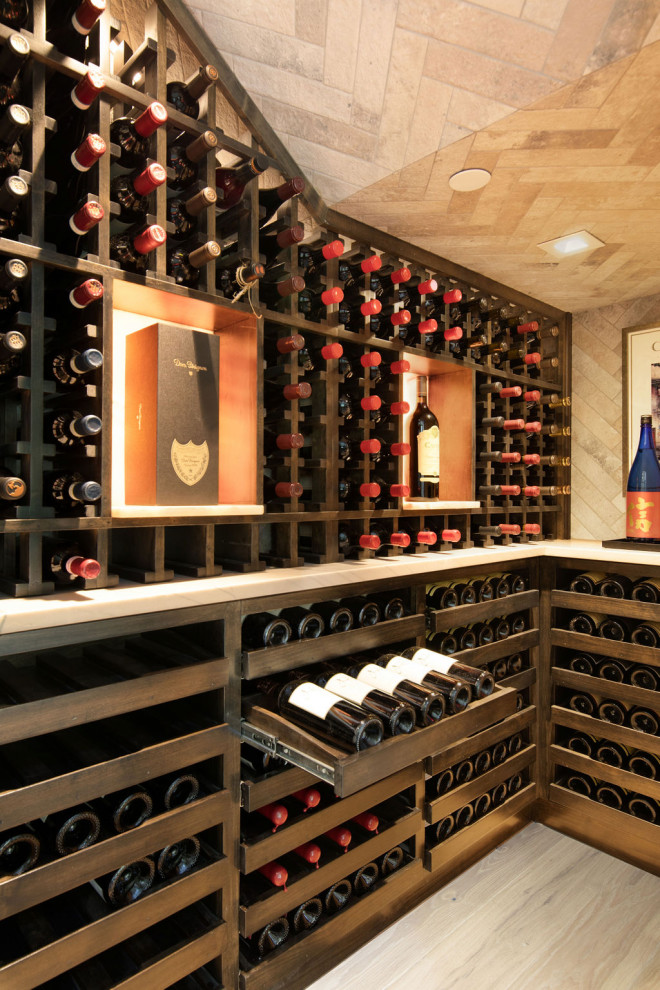 Inspiration for a mid-sized transitional wine cellar in Austin with light hardwood floors and storage racks.