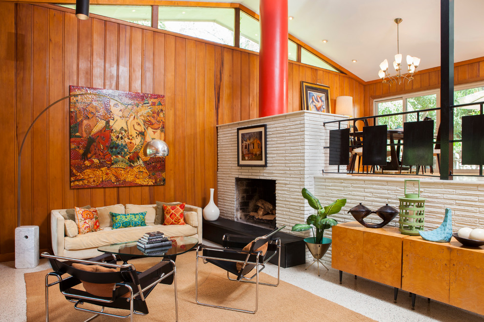 Midcentury living room in Atlanta with a standard fireplace.