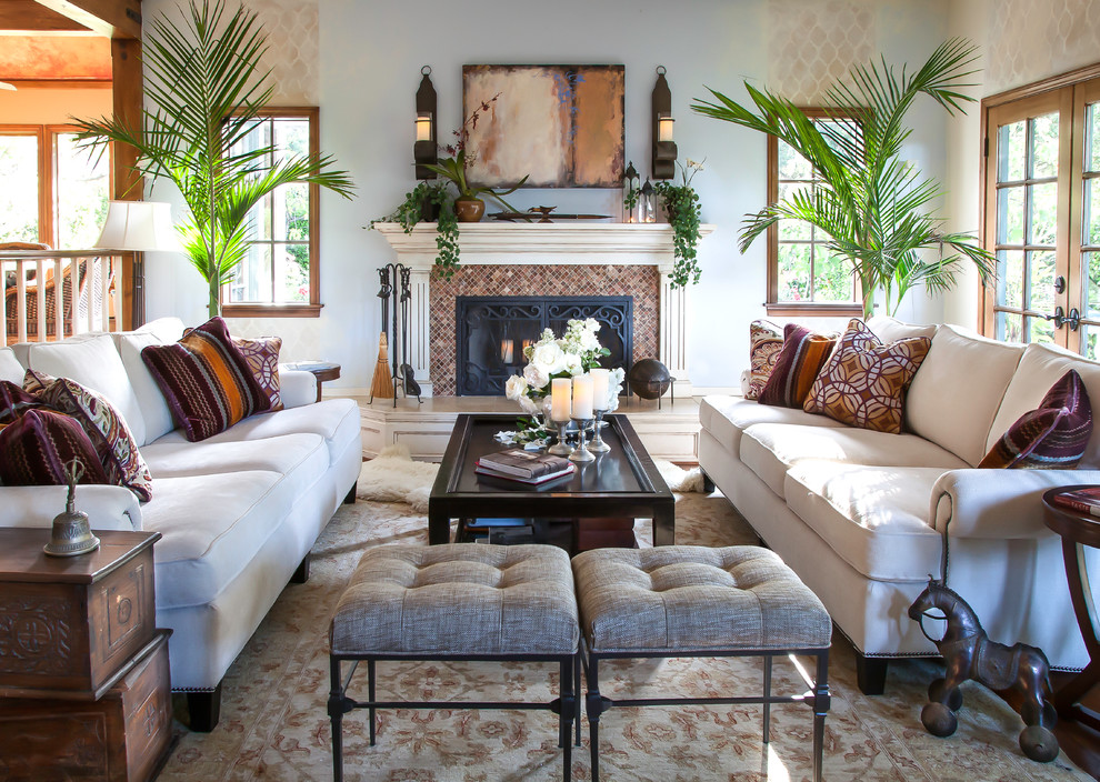 Living room - mid-sized traditional open concept and formal medium tone wood floor living room idea in Santa Barbara with blue walls, a standard fireplace, no tv and a tile fireplace