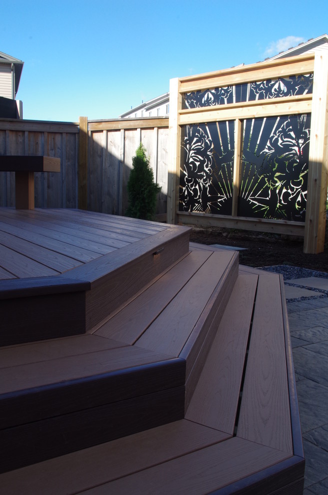 Mid-sized modern backyard shaded garden in Toronto with decking.