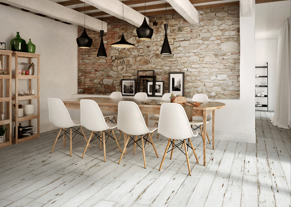 Inspiration for a mid-sized industrial dining room in Montreal with ceramic floors.