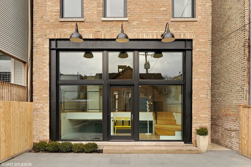 Large modern three-storey brick yellow exterior in Chicago with a flat roof.