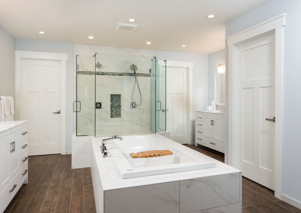Design ideas for a large transitional master bathroom in Detroit with shaker cabinets, white cabinets, marble benchtops, brown tile, porcelain tile, a drop-in tub, an open shower, an undermount sink, a two-piece toilet, blue walls and porcelain floors.