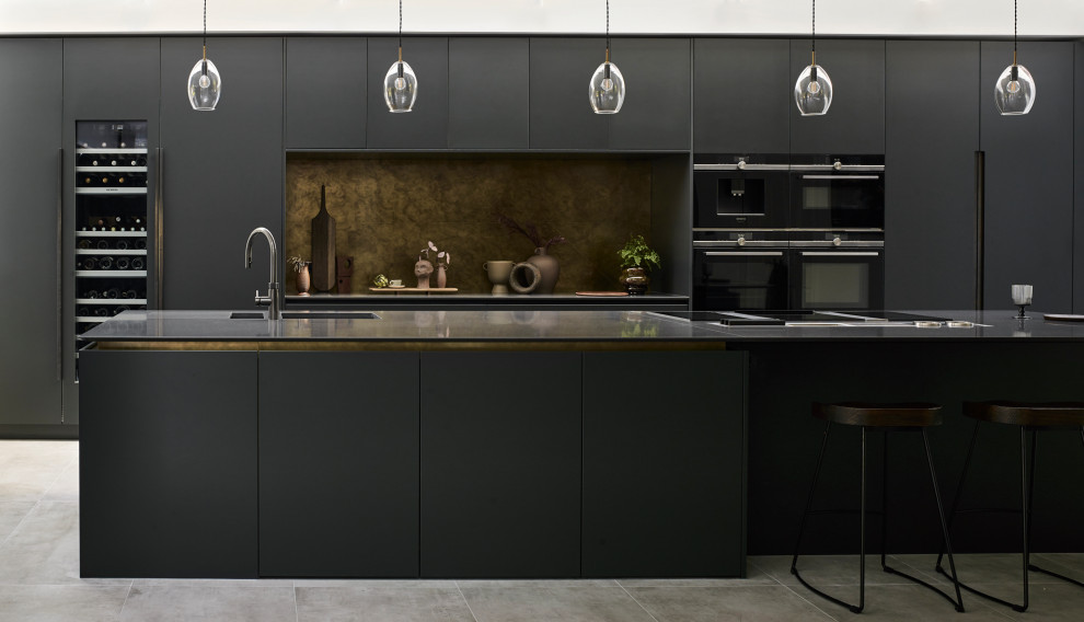 This is an example of a contemporary kitchen in London with an island.