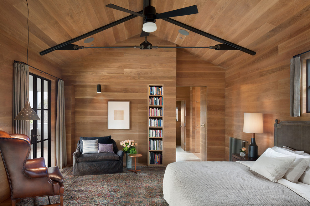 Photo of a contemporary bedroom in San Francisco with brown walls, medium hardwood floors and brown floor.