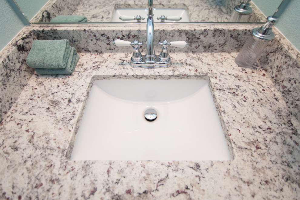This is an example of a mid-sized 3/4 bathroom in Dallas with beige cabinets, granite benchtops and white tile.