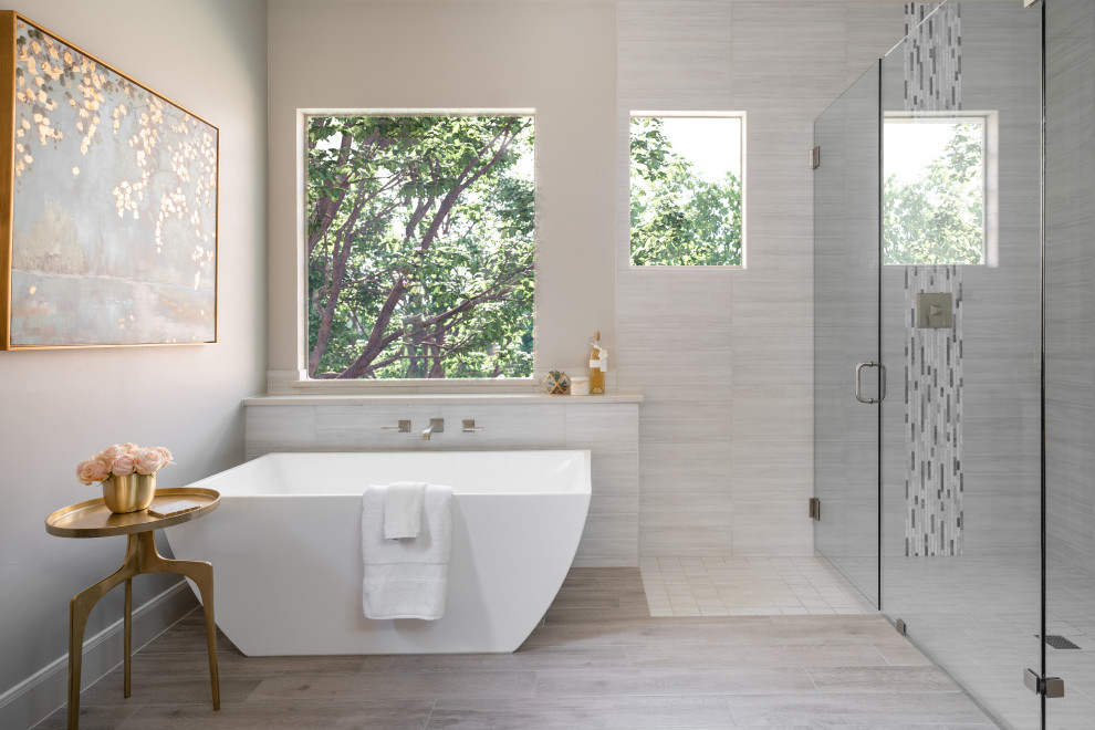 Inspiration for a transitional gray tile and ceramic tile wood-look tile floor freestanding bathtub remodel in Dallas with a hinged shower door