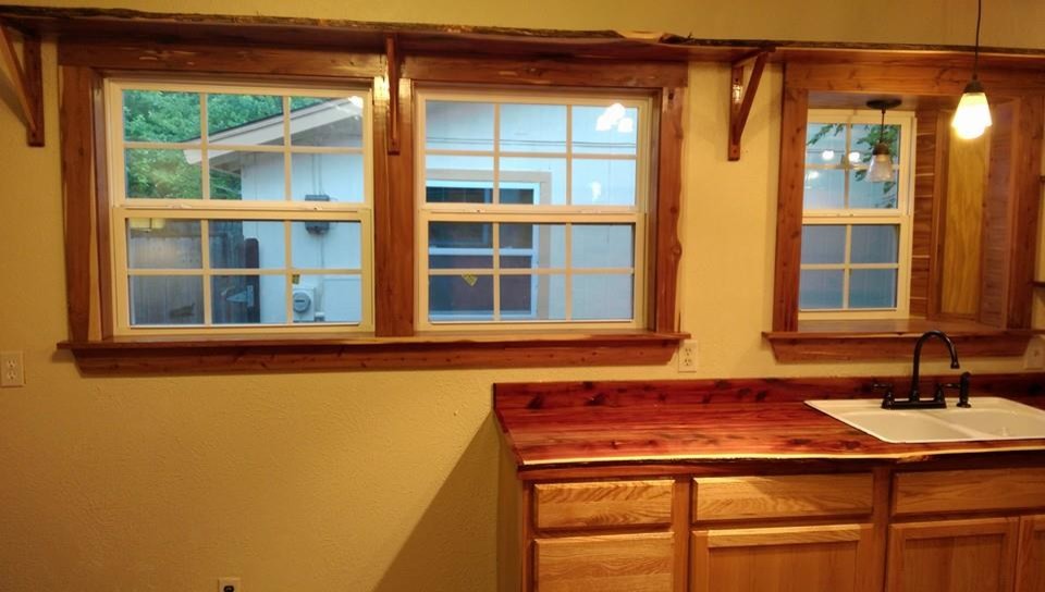 Inspiration for a mid-sized galley medium tone wood floor eat-in kitchen remodel in Austin with a drop-in sink and no island