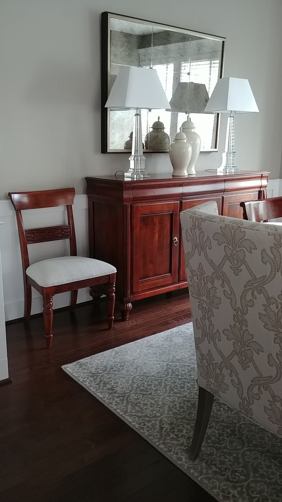 Mid-sized transitional separate dining room in DC Metro with grey walls, dark hardwood floors and brown floor.