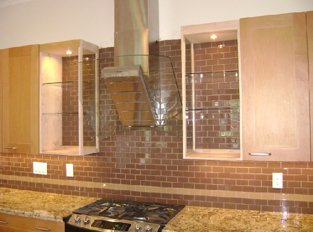 Example of a trendy u-shaped kitchen design in Houston with medium tone wood cabinets, granite countertops, brown backsplash and stainless steel appliances