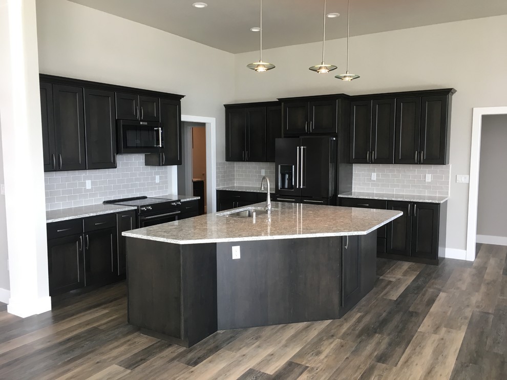 Inspiration for a large contemporary u-shaped vinyl floor and gray floor open concept kitchen remodel in Seattle with quartz countertops, gray backsplash, porcelain backsplash and an island