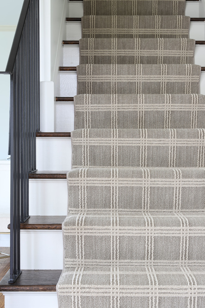 Derby House Kids Wing - Renovated staircase including stained treads, new metal railing, and windowpane plaid staircase runner. Photo by Emily Kennedy Photography.