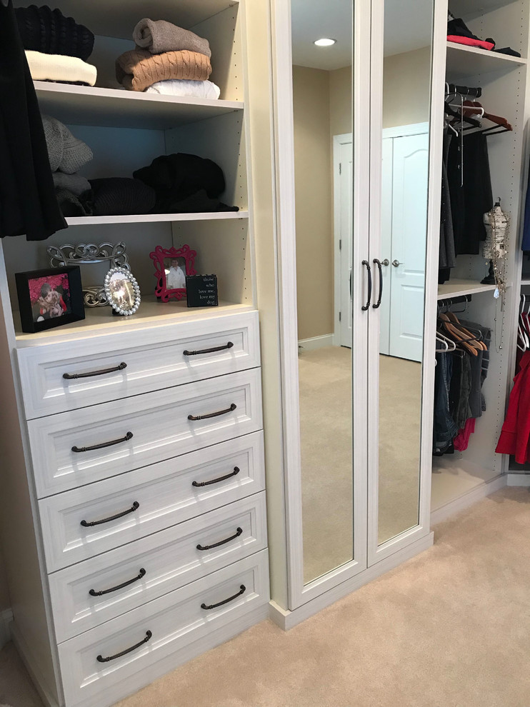 Inspiration for a large transitional women's dressing room in DC Metro with recessed-panel cabinets and white cabinets.