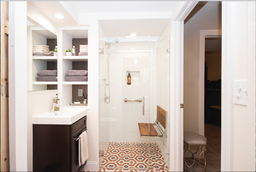Design ideas for a small eclectic master bathroom in Providence with recessed-panel cabinets, dark wood cabinets, a curbless shower, a two-piece toilet, white tile, subway tile, beige walls, mosaic tile floors, a drop-in sink, orange floor and a hinged shower door.