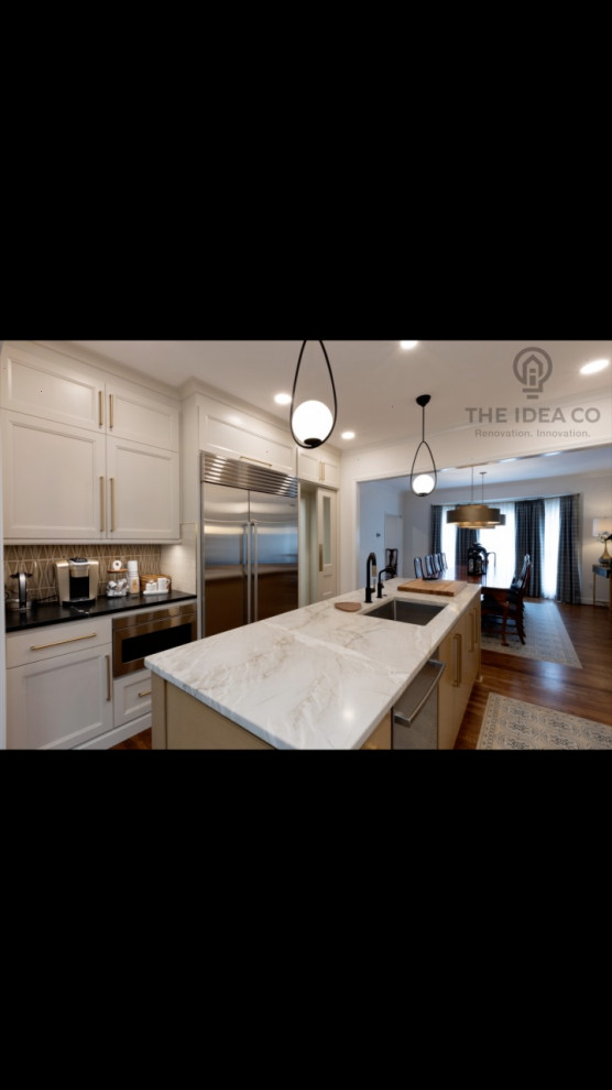 Example of a mid-sized transitional galley light wood floor and brown floor kitchen pantry design with a single-bowl sink, recessed-panel cabinets, white cabinets, quartzite countertops, multicolored backsplash, ceramic backsplash, stainless steel appliances, an island and white countertops